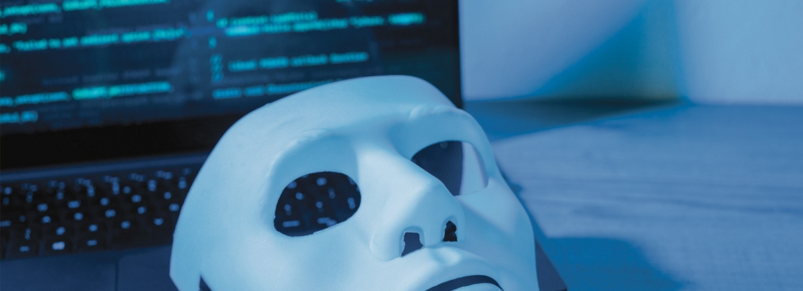 mask in front of a computer